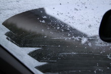 Squeegee Frosted Windshield In The Morning