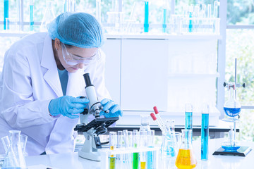 Wall Mural - Asian woman scientist, researcher, technician, or student conducted research in laboratory