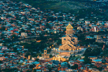 Wall Mural - Tbilisi Georgia. Evening Aerial View Of Illuminated Sameba Complex, Holy Trinity Cathedral, Summer