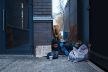 Bearded Beggar Sleeping On City Street