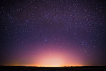 Wall Mural - Real Night Sky Stars Background With Natural Colourful Sky Gradient. Sunset, Sunrise Light And Starry Sky. Yellow And Magenta Colors