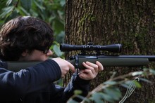 MAN Aiming Gun By TREE