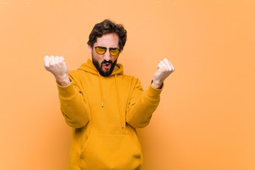 Wall Mural - young crazy cool man celebrating a success