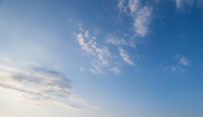 Wall Mural - blue sky clouds background. beautiful landscape with clouds and orange sun on sky