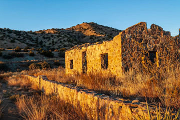 Wall Mural - Old Abandoned Stone House and Wall at Sunset 