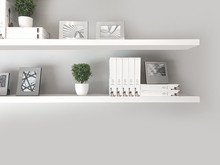 Potted Plants With Decor On Shelf Against White Wall At Home