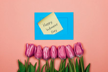 Pink Tulips And Blue Envelope On Pink Background. Womens Day Card
