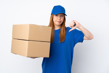 Young delivery woman over isolated white background showing thumb down sign