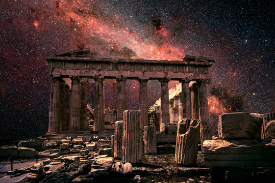 athens at night, greece. fantasy view of parthenon on milky way background. this old temple is top l