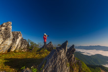 Woman Photographing On Doi Pha Tang Against Clear Blue Sky