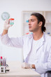 © Elnur - Young male chemist working in the lab