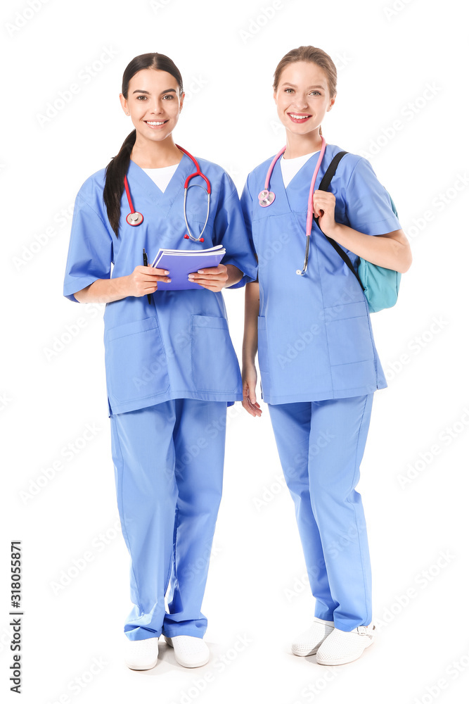 Female medical students on white background