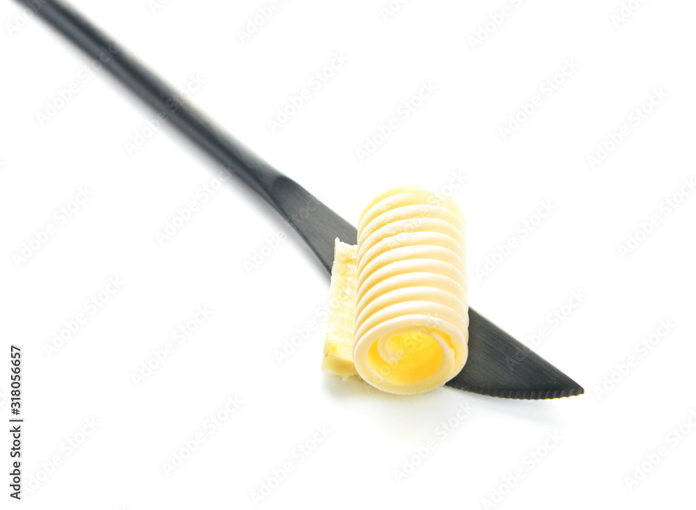 Knife with fresh butter on white background