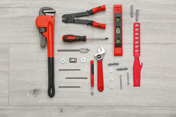 Set of tools for furniture assembling on wooden background