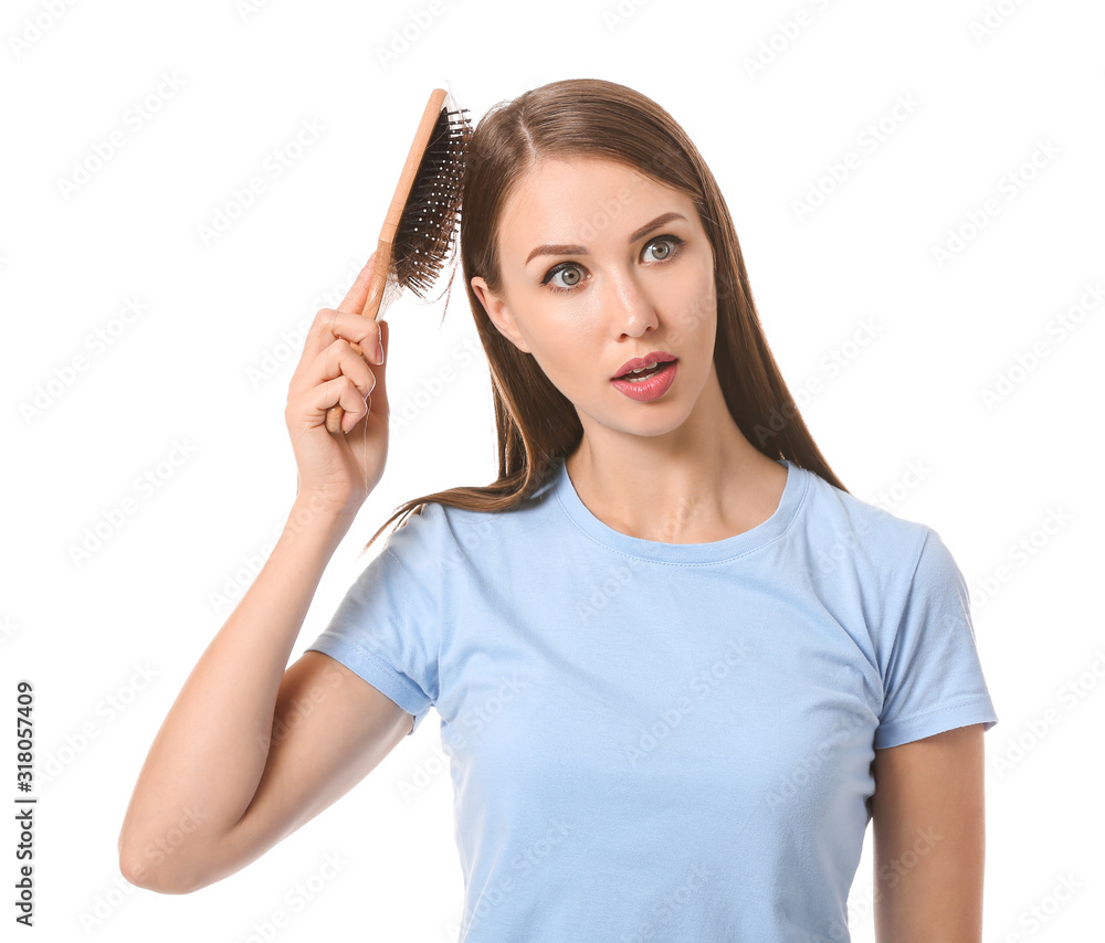 Young woman with hair loss problem on white background