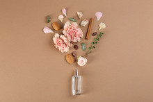 Flat Lay Composition With Bottle Of Perfume On Light Brown Background