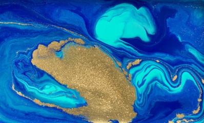 Marbled blue and gold abstract background. Liquid marble pattern.