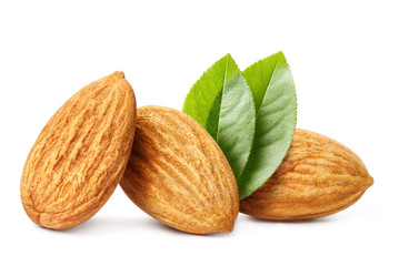 Big ripe almonds with leaves, isolated on white