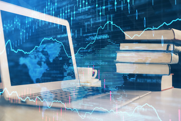 Stock market chart hologram drawn on personal computer background. Multi exposure. Concept of investment.