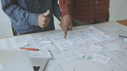Designers man drawing (UX) (UI) Graphic designer creative sketch planning application process development prototype for responsive web desig