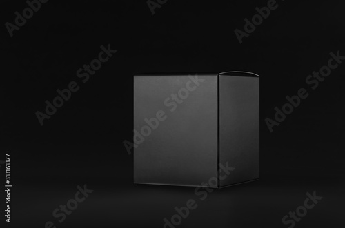 Elegant black paper cube box on dark black background, side view, mock up of packing for product, advertising, presentation, design.