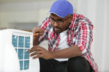 a male air conditioning technician