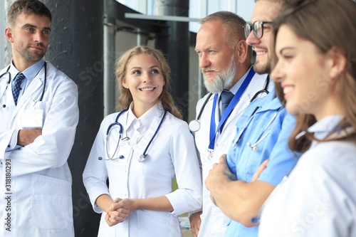 Zdjęcie: Team of different doctors having conversation in hospital. Team of different doctors having conversation in hospital.