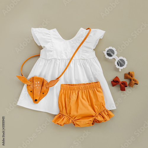 White Dress Orange Shorts With Kids Handbag And Sunglasses Set Of Baby Clothes And Accessories For Spring Or Summer On Beige Background Fashion Childs Outfit Flat Lay Top View Stock Photo Download free flatlay images for your website hero image or background picture. adobe stock