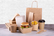 Recycling concept. Delivery food background. Fast food eco packaging with tasty hamburger, french fries, paper coffee cup and soup