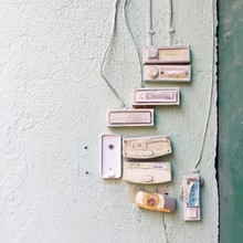 Old Doorbells Mounted On White Wall