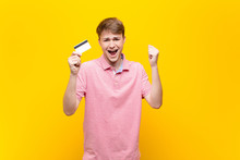 Young Blonde Man With A Credit Card