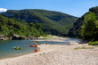 People canoeing and  kayaking in Ardeche river near Pont D'Arc in France