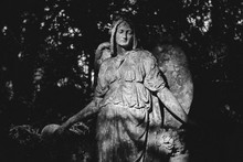 Old Angel Statue In Cemetery