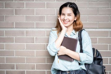 Wall Mural - Happy young Asian University student.