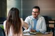 © Dragana Gordic - Doctor shaking hands with woman. Female patient visiting health professional. They are in hospital. Cropped shot of a handsome young male doctor and his patient shaking hands in the hospital
