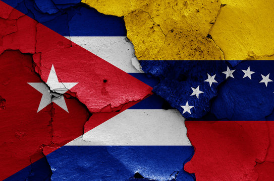 flags of Cuba and Venezuela painted on cracked wall