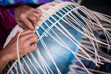 Cropped Image Of Person Weaving Wicker Basket