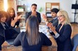 © Krakenimages.com - Group of business workers smiling happy and confident. Working together with smile on face applauding one of them at the office