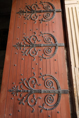 Wall Mural -  Decorated hinges in the door of Saint Trophime Cathedral in Arles, France. Bouches-du-Rhone, France