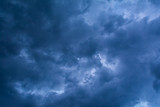 Fototapeta Niebo - Dramatic cloudscape sky background with dark blue clouds, storm