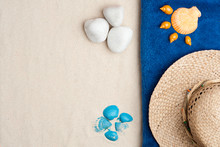 Summer Time Concept With Seashells, Blue And Orange Shells, Pebbles, Straw Hat, On White Sand Background