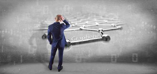 Wall Mural - Businessman holding a graphene structure - 3d rendering