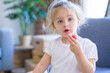 © Krakenimages.com - Beautiful toddler child girl eating strawberry