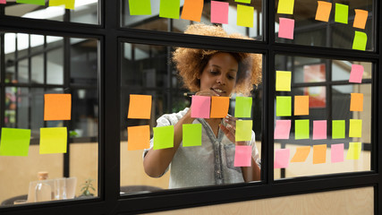 Wall Mural - african american female employee develop plan on sticky notes