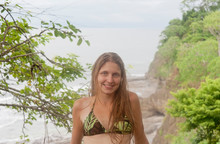Portrait Of Young Woman Wearing Bikini Standing Against Sea At Island