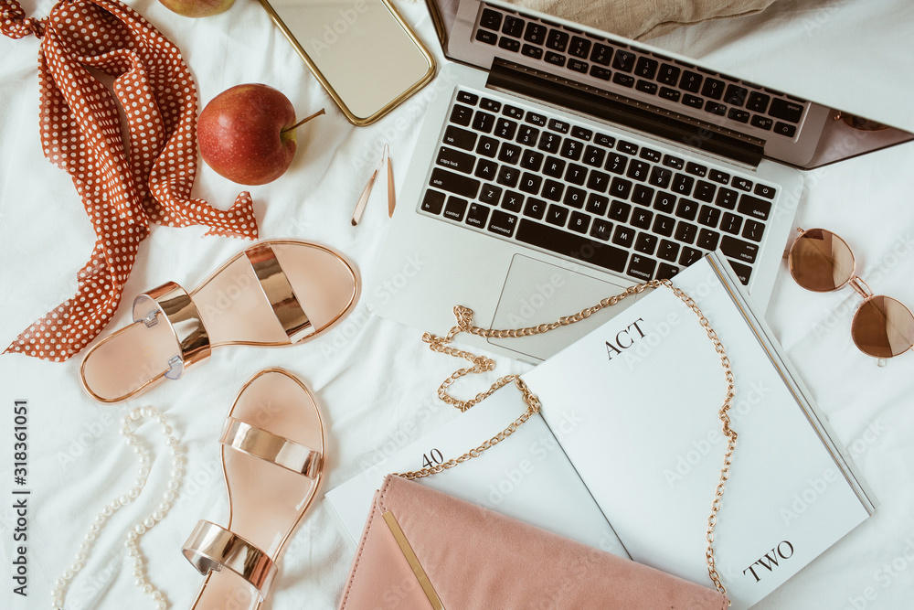 Women fashion pink styled home work space with bijouterie on white linen. Laptop, slippers, purse bag, sunglasses, jewelry. Flat lay, top view girl boss business hero header concept. - obrazy, fototapety, plakaty 