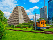Metropolitan Cathedral Of Saint Sebastian And Old Yellow Santa Teresa Tram (Bonde De Santa Teresa) Is A Historic Tram Line In Rio De Janeiro, Brazil.