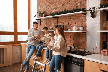 Canvas Print - Happy family resting together in kitchen