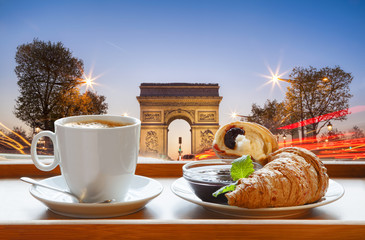 Wall Mural - Coffee with croissants against Arc de Triomphe in Paris, France