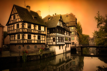 Canvas Print - Strasbourg France with old half timbered homes and river at sunset